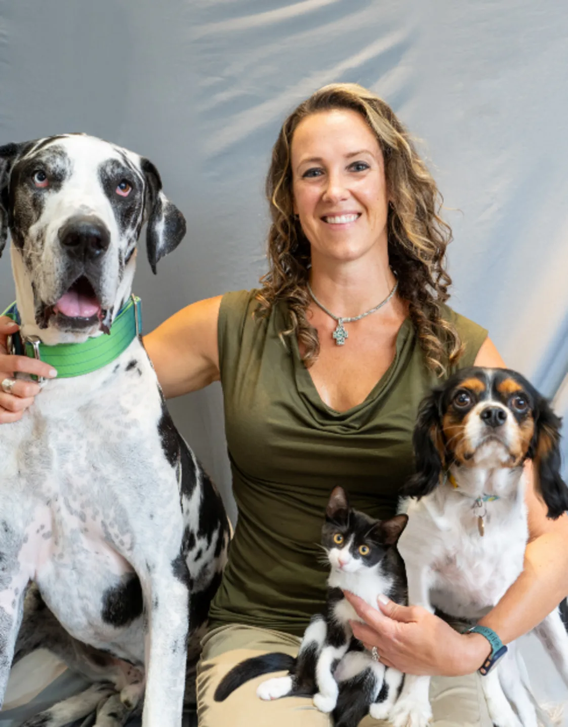 Caroline sitting with two dogs Caroline sitting with two dogs
