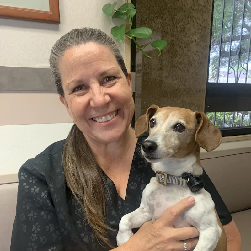 Debra Cortez with small dog on her lap Debra Cortez with small dog on her lap