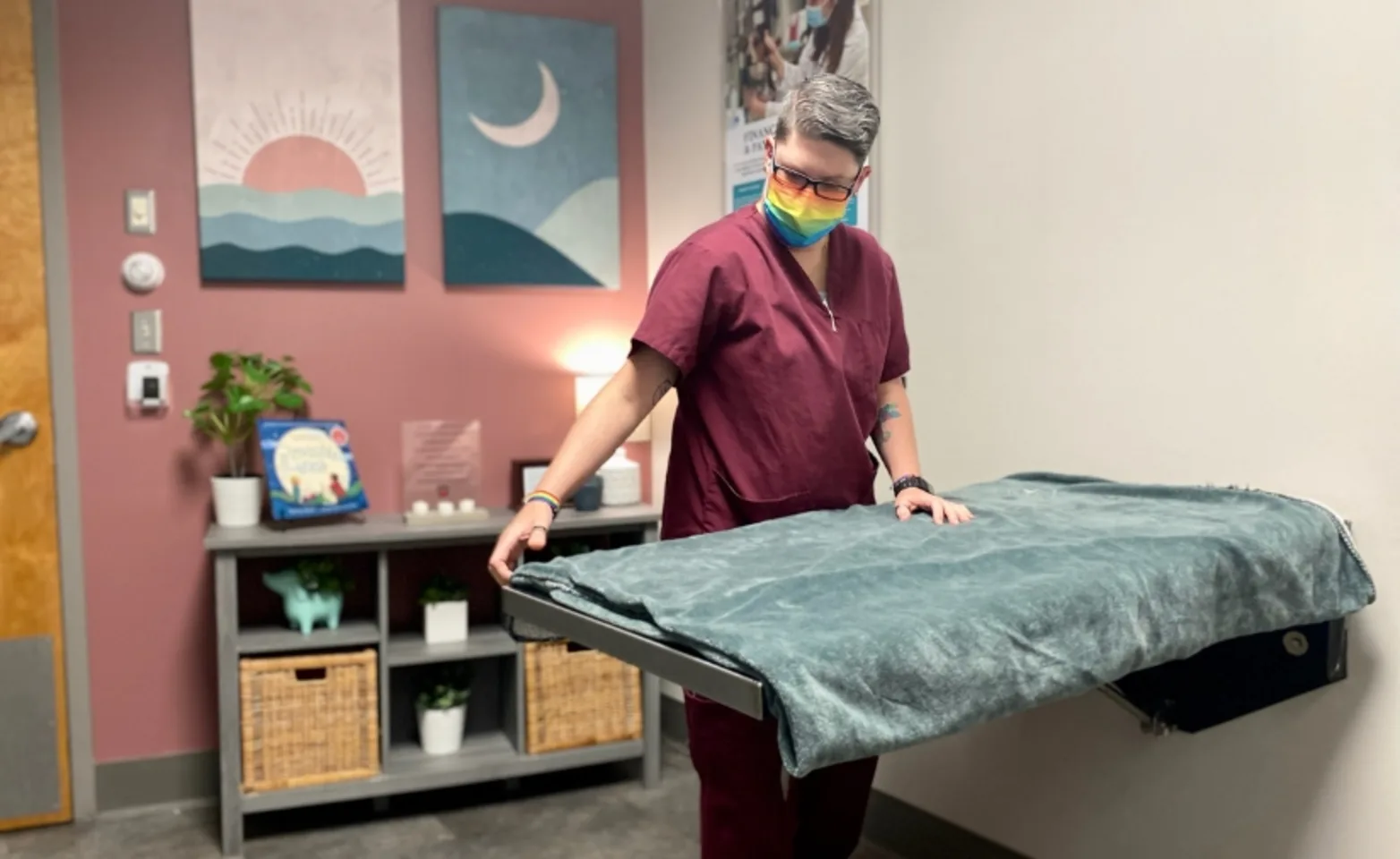 Veterinary staff setting up exam table. Veterinary staff setting up exam table.