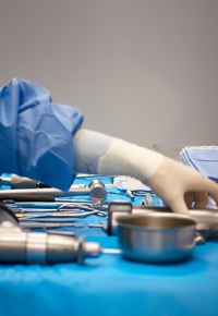 Doctor grabbing for tools