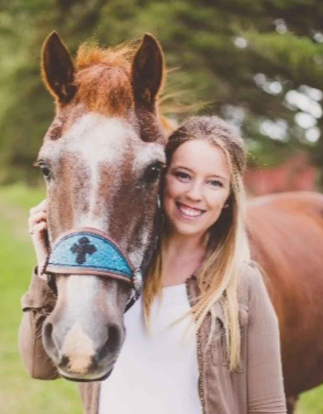 Cassie posing next to a horse Cassie posing next to a horse