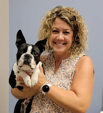 Jessica Heck holding black and white puppy Jessica Heck holding black and white puppy