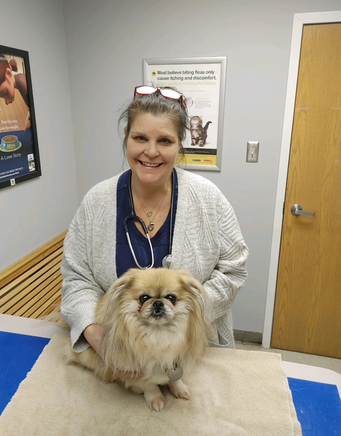 Dr. Kopilak Smiling with a fluffy dog Dr. Kopilak Smiling with a fluffy dog