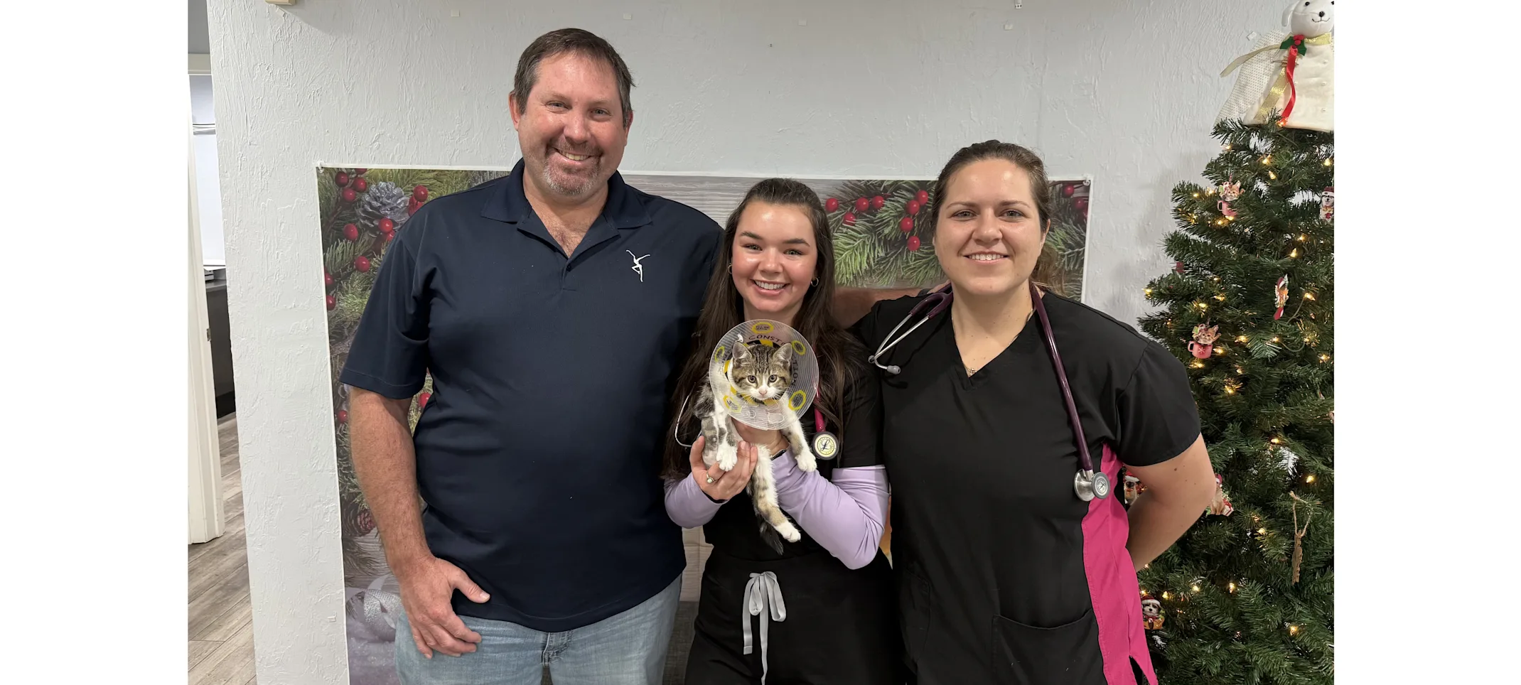 Dr. Sturgeon and staff with cat Dr. Sturgeon and staff with cat