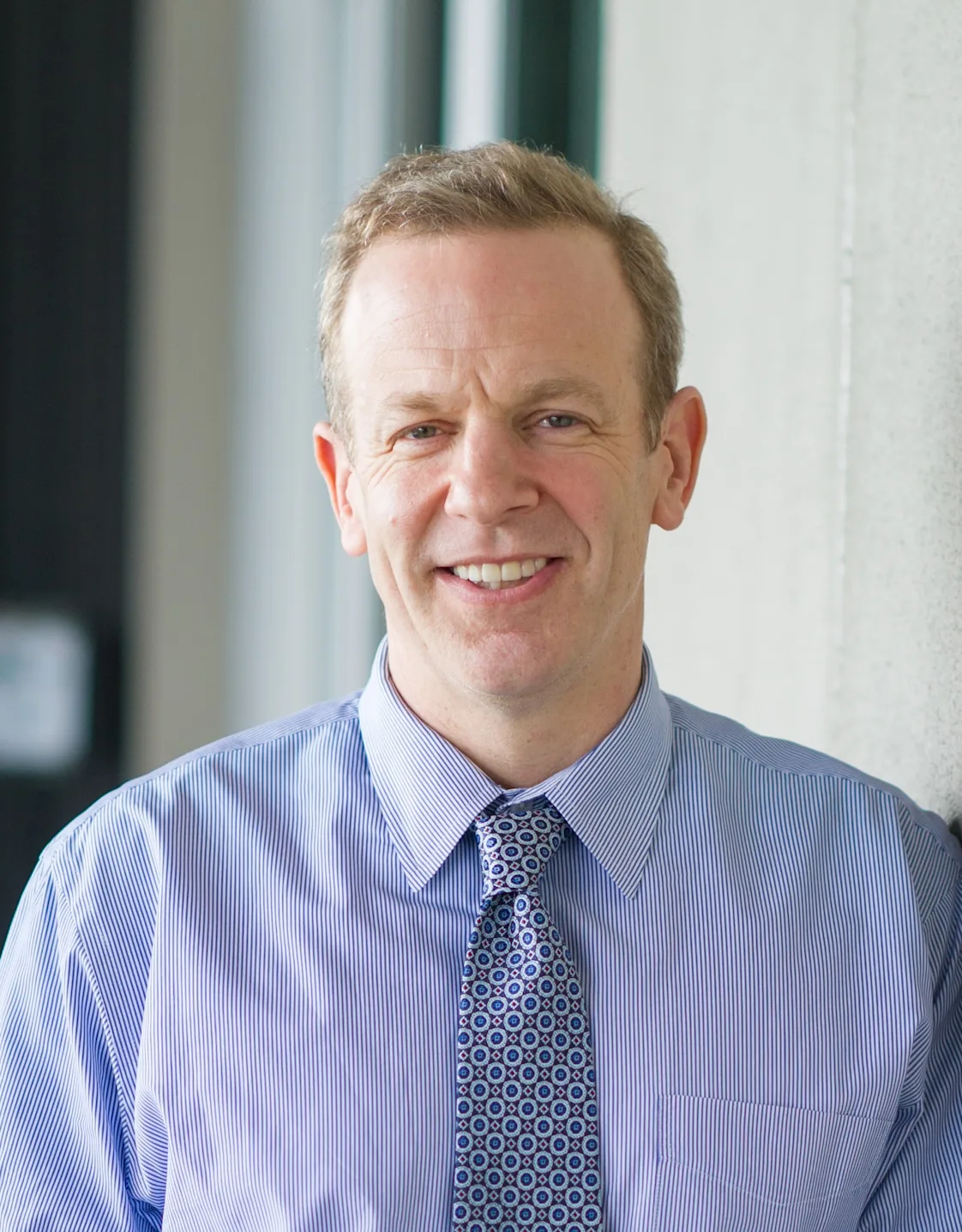 William Bush smiling in their suit. William Bush smiling in their suit.