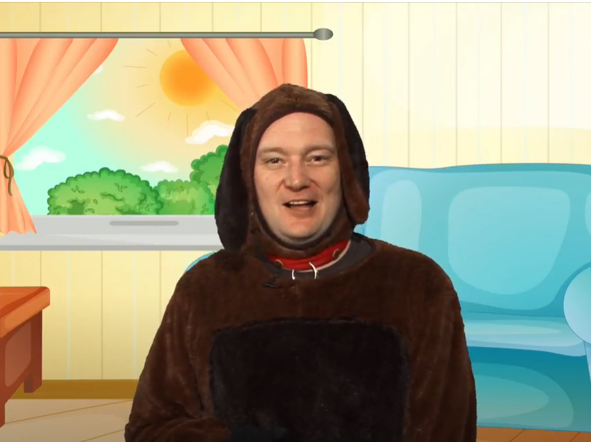 Man wearing a dark brown dog costume