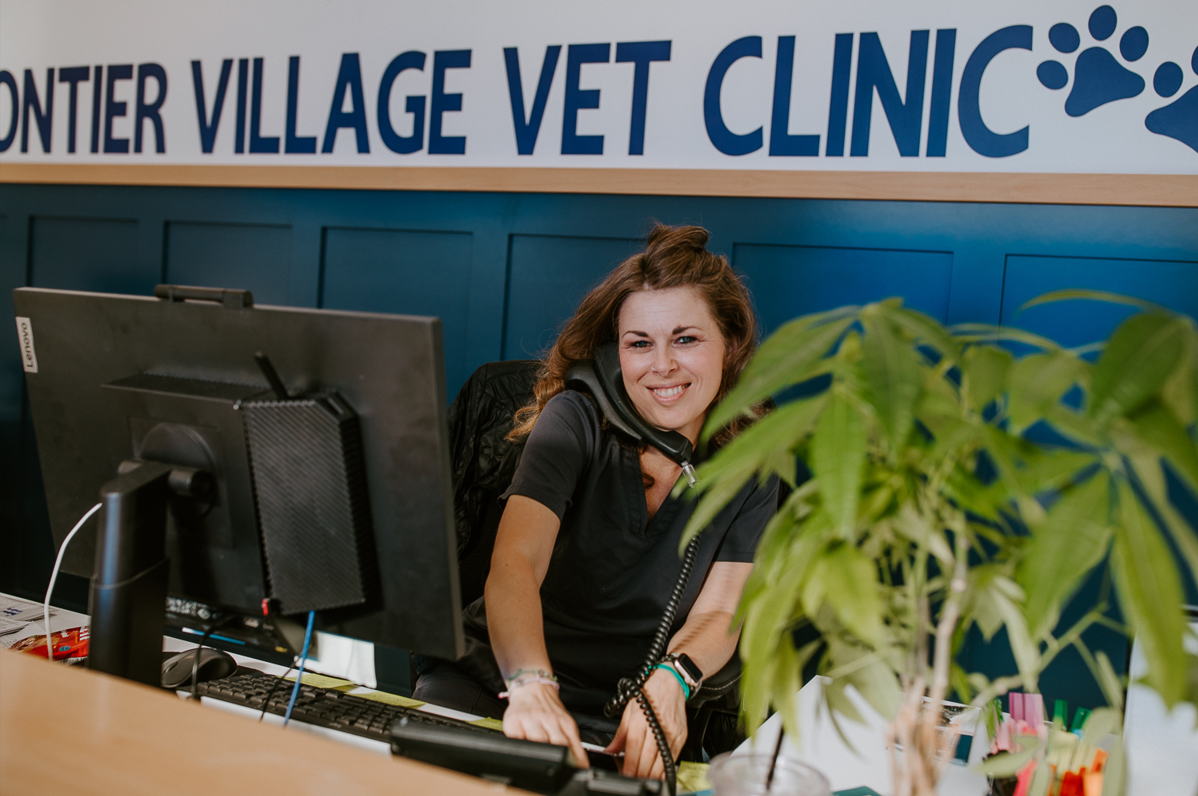 Frontier Village Veterinary Clinic receptionist taking a phone call