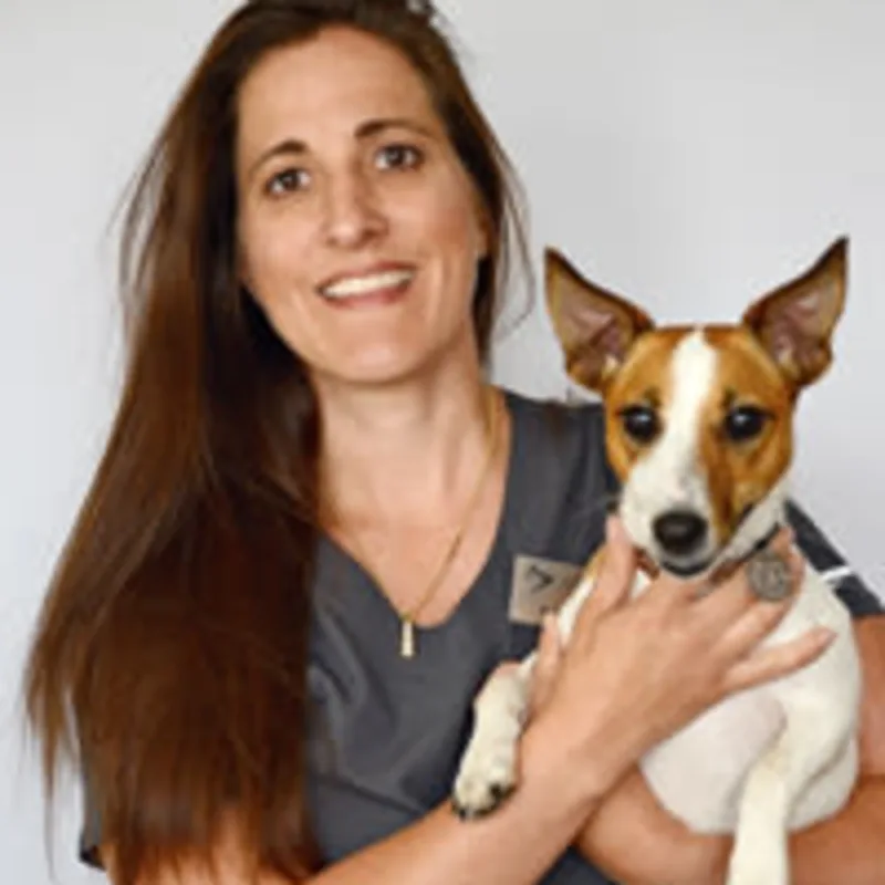 Dr. Dziak HOLDING A DOG Dr. Dziak HOLDING A DOG