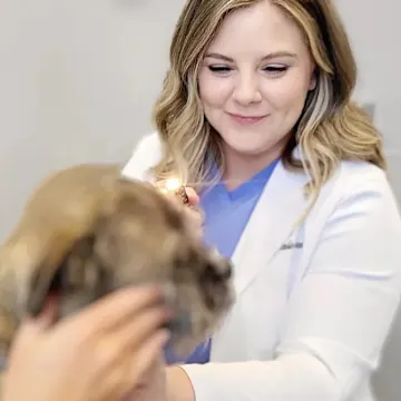 Dr. Quantz holding a senior cat. Dr. Quantz holding a senior cat.