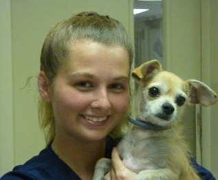 Camden holding a small dog