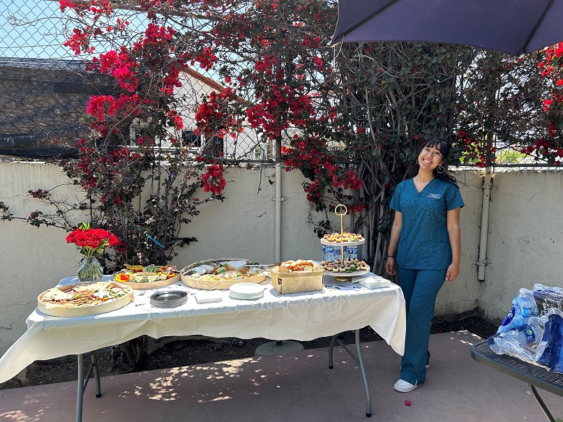 Photo of staff member in front of food- Gisella