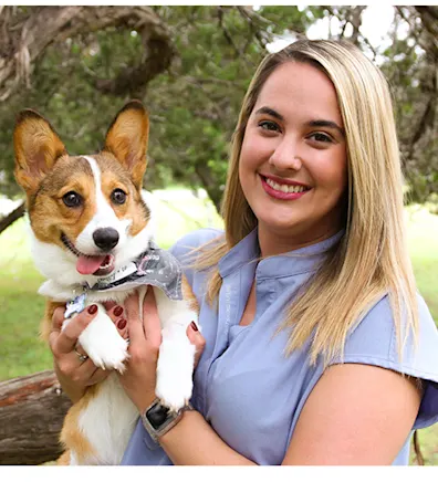 A photo of Lauren with her Corgi, Princess Leia 