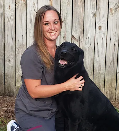 Allison Federkeil with a black dog