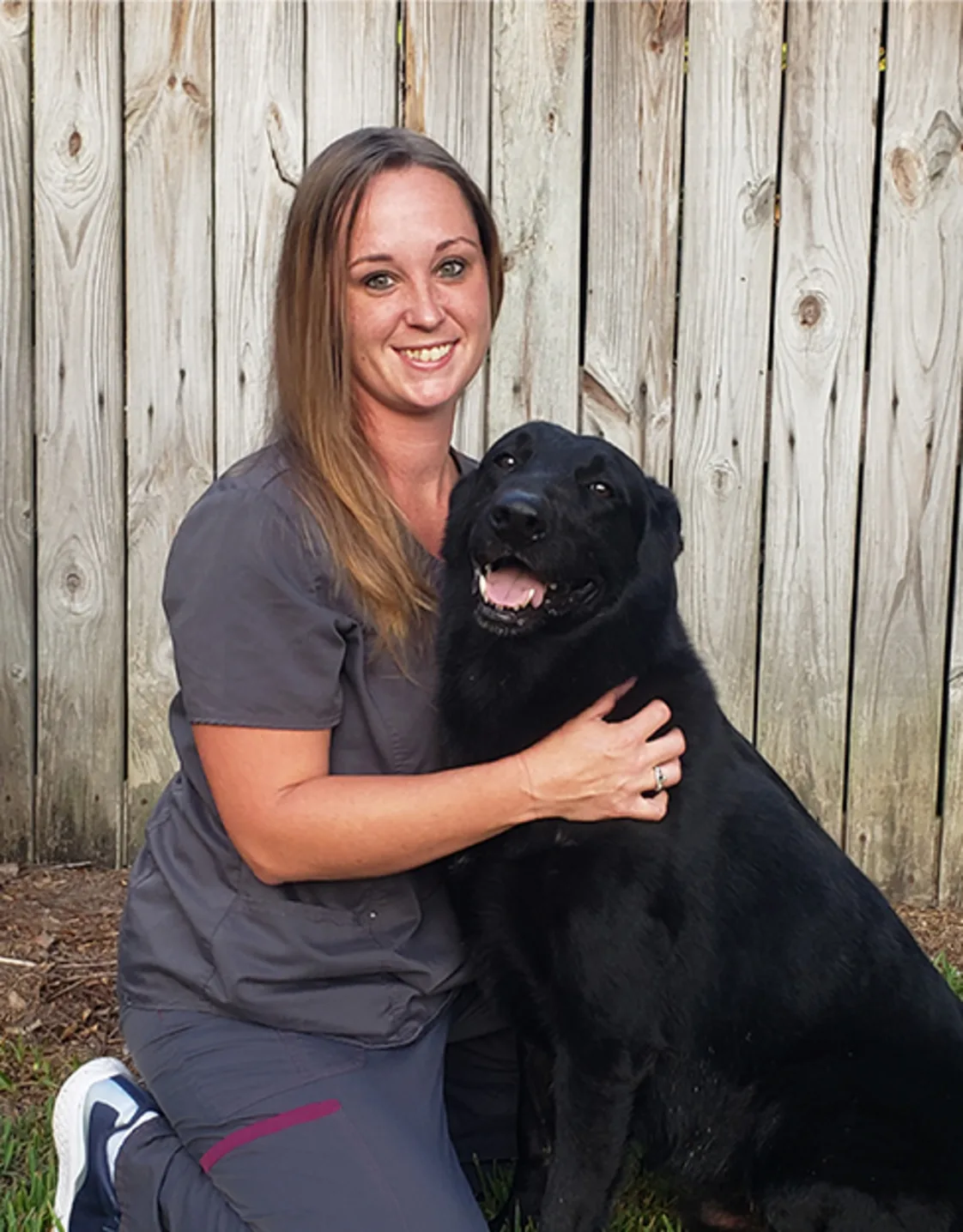 Allison Federkeil with a black dog Allison Federkeil with a black dog