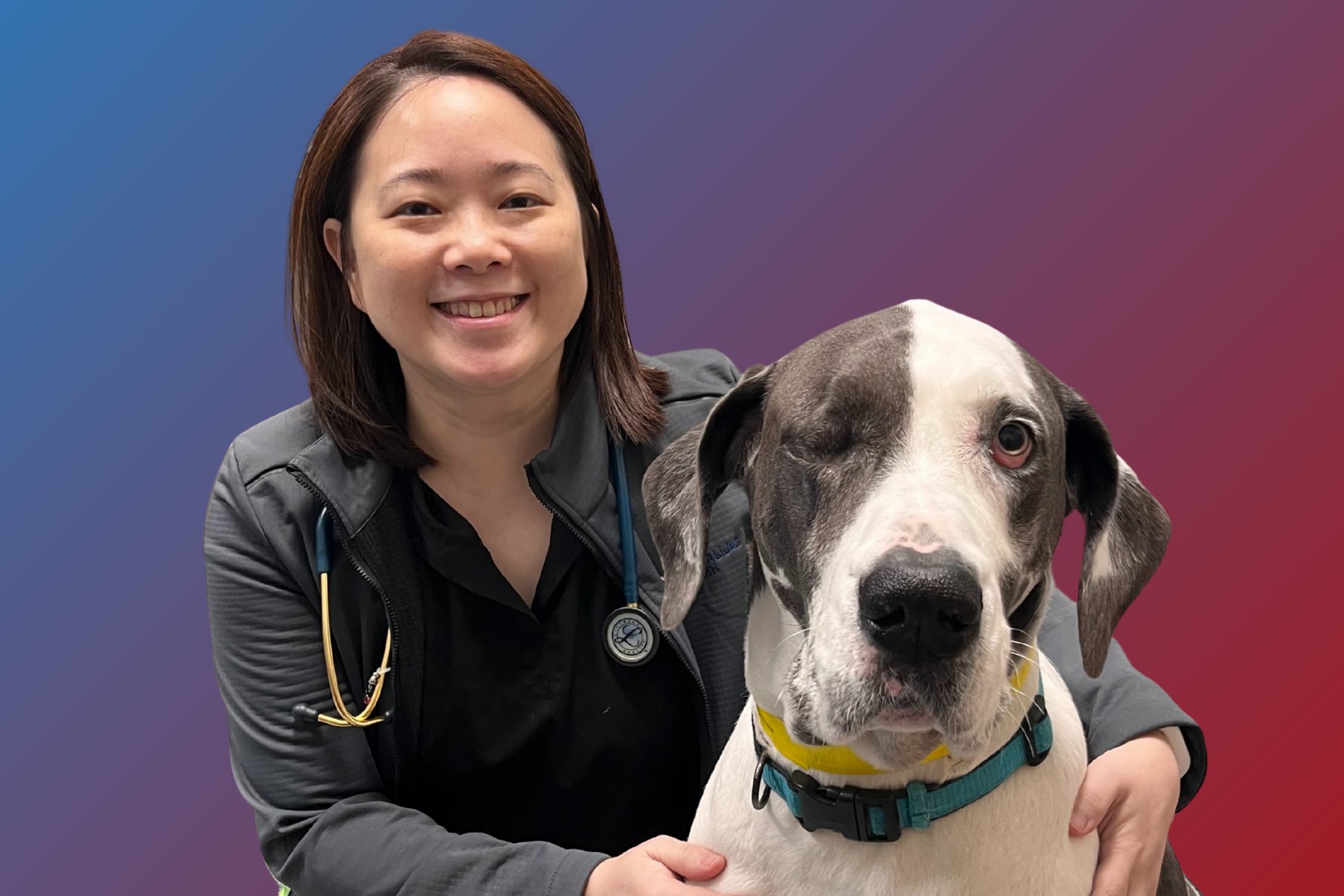 Dr. Young posing with a dog.
