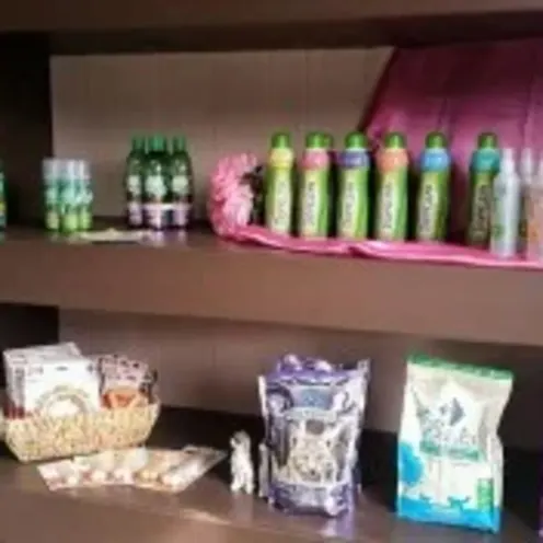 A shelf containing Clarksville Kennels retail products such as shampoos, treats, and pet toys A shelf containing Clarksville Kennels retail products such as shampoos, treats, and pet toys