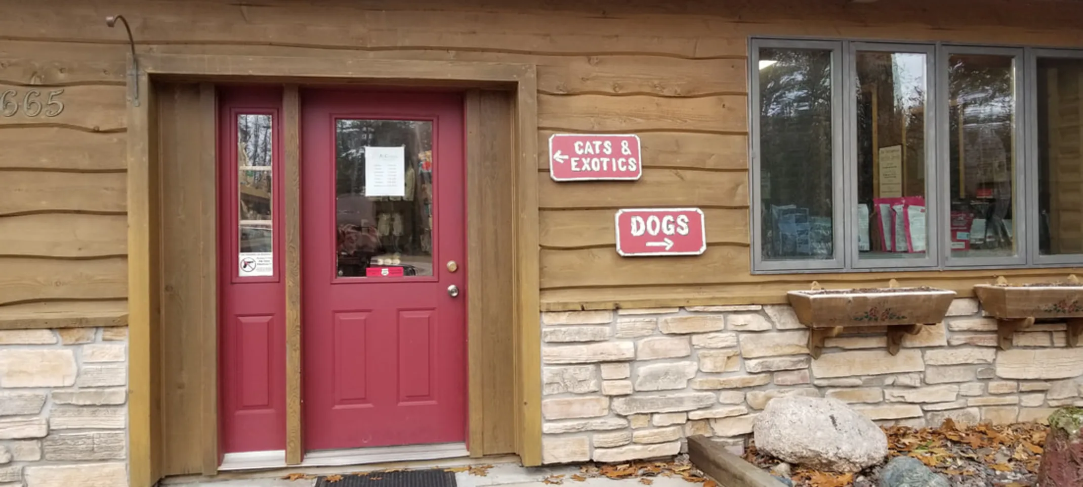 Signs indicating where patients should go if they are bringing in a cat/exotic animal or a dog at All Creatures Veterinary Clinic Signs indicating where patients should go if they are bringing in a cat/exotic animal or a dog at All Creatures Veterinary Clinic