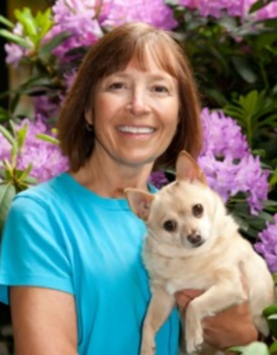 Dr. Erdman holding a dog at Laurelwood Animal Hospital Dr. Erdman holding a dog at Laurelwood Animal Hospital