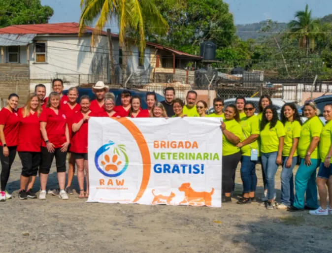 Allandale's staff posing at Roatan Honduras near a RAW banner Allandale's staff posing at Roatan Honduras near a RAW banner