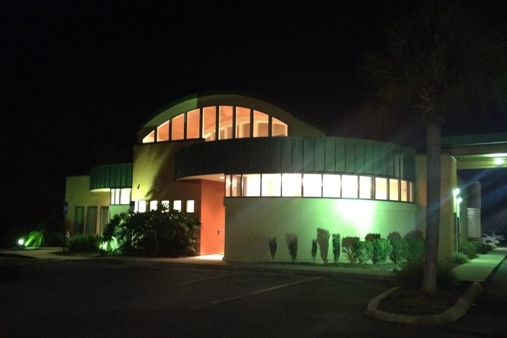 Animal Care Center of Panama City Beach at night with the lights on outside