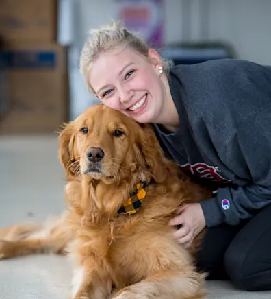 Sam with golden retriever at Tacoma Animal Hospital