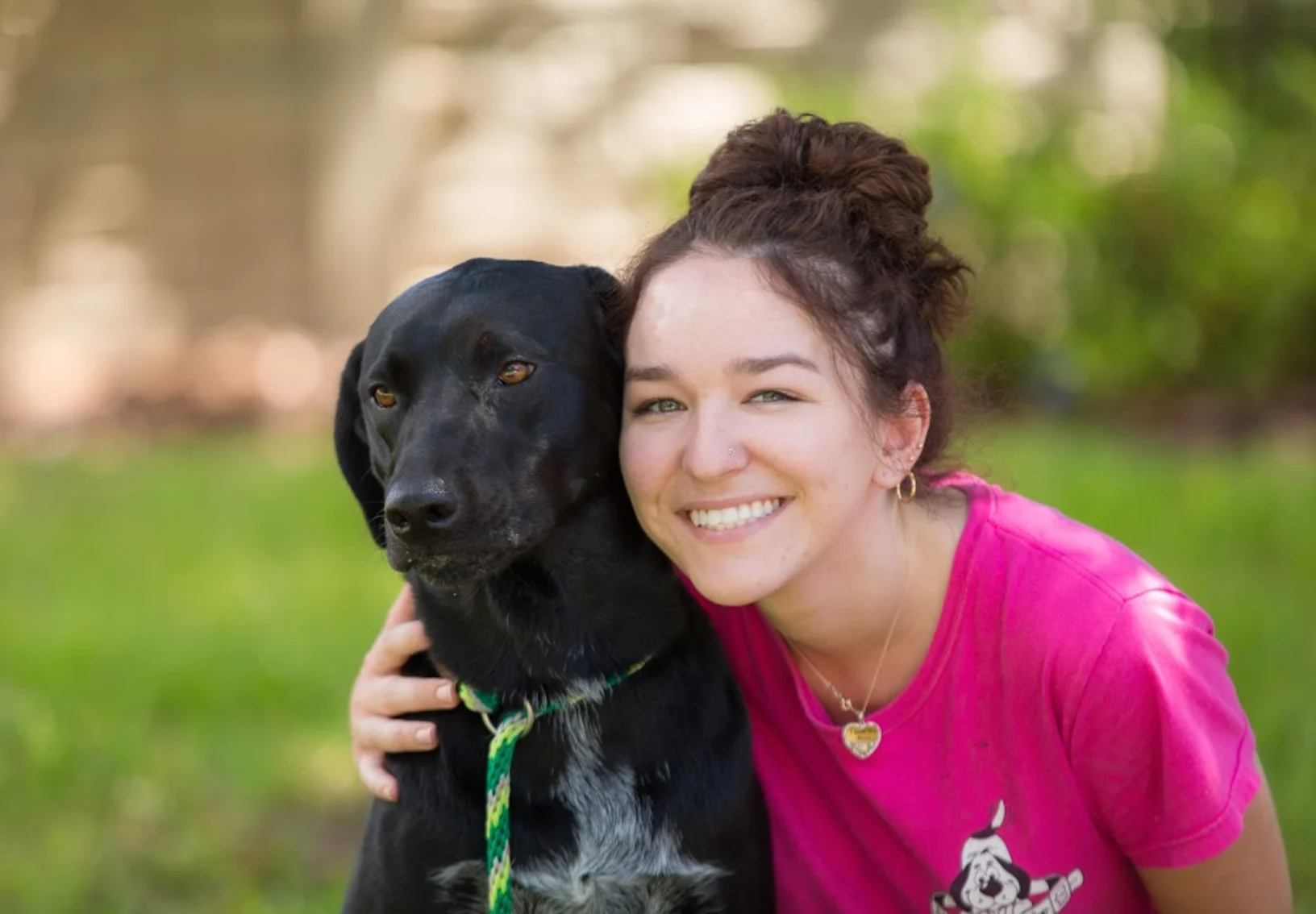 Advantage Pet Center staff with black dog