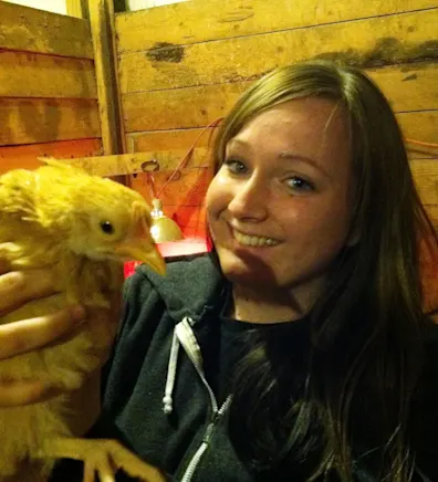 Lindsey, a Veterinary Assistant at Apollo North Animal Hospital, Holding a Chicken Lindsey, a Veterinary Assistant at Apollo North Animal Hospital, Holding a Chicken