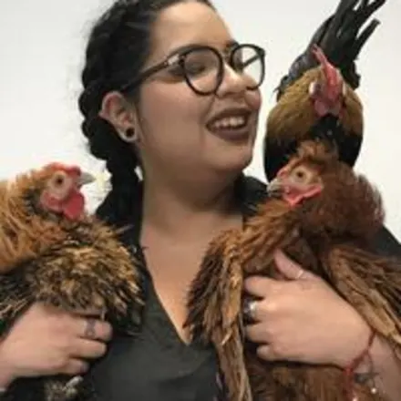 Lucy holding chickens