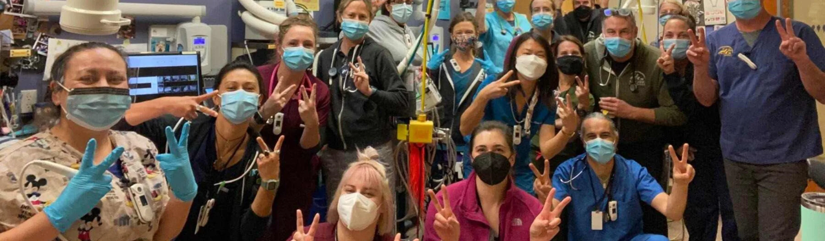 Staff members posing for the camera Staff members posing for the camera