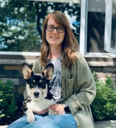 Morgan holding a small dog