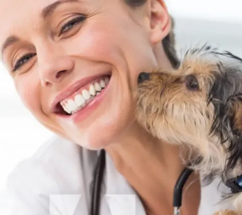 Dog Kissing Woman Doctor Smiling
