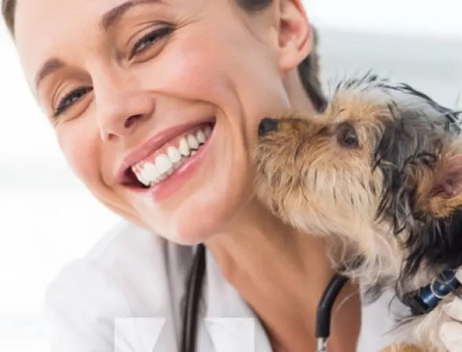 Dog Kissing Woman Doctor Smiling