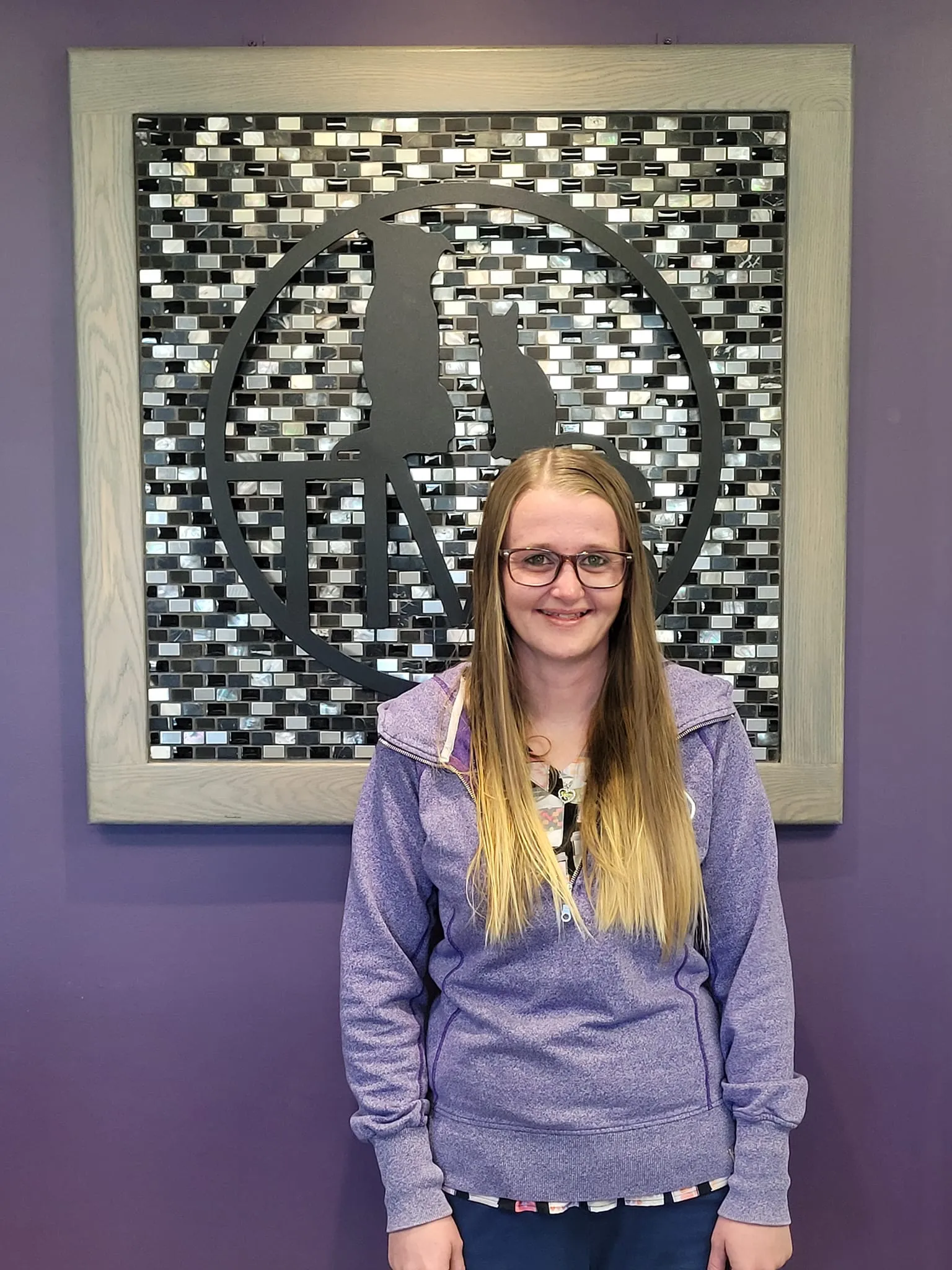 Tanya in front of a purple wall