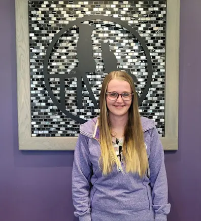 Tanya in front of a purple wall Tanya in front of a purple wall