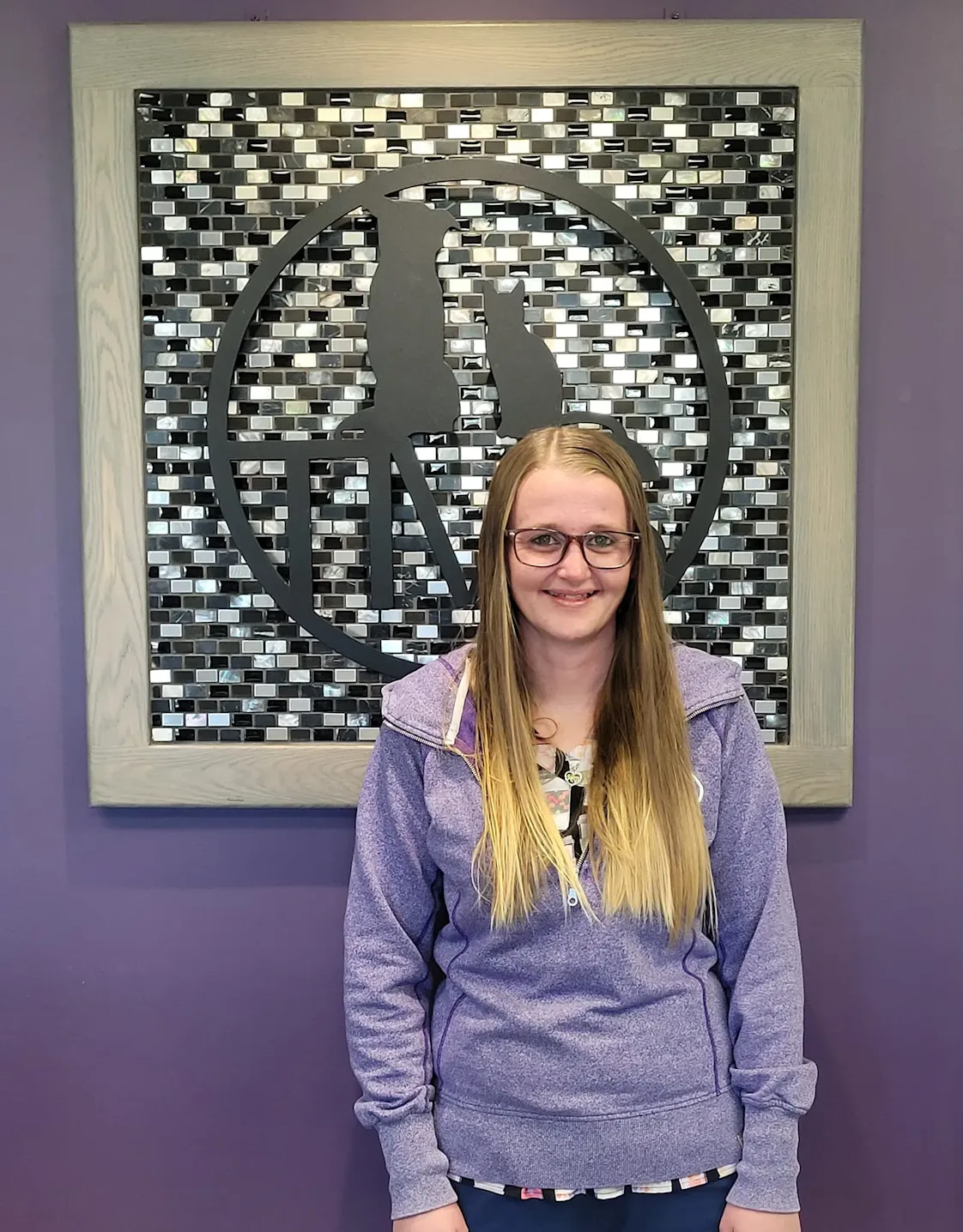 Tanya in front of a purple wall Tanya in front of a purple wall