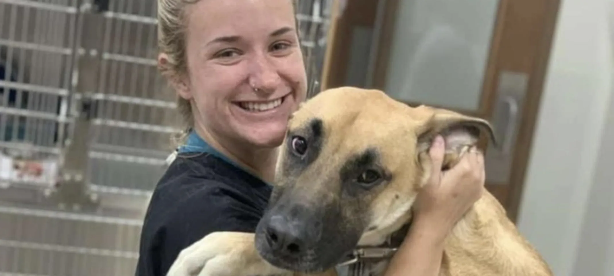 Staff Member Hugging a Dog Staff Member Hugging a Dog