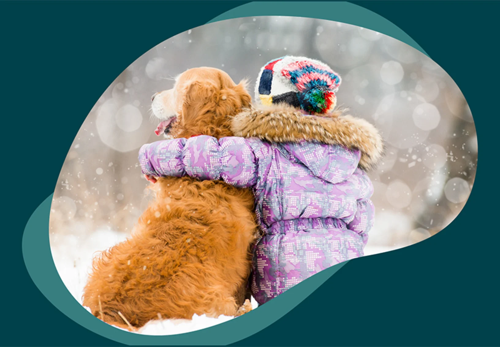 A child and dog sitting outside in the snow together A child and dog sitting outside in the snow together