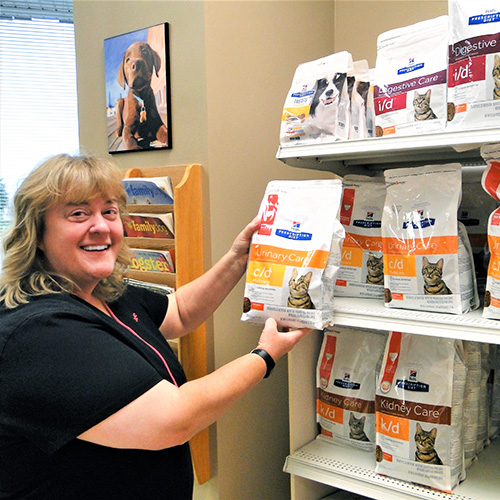 Joanne posing with cat food
