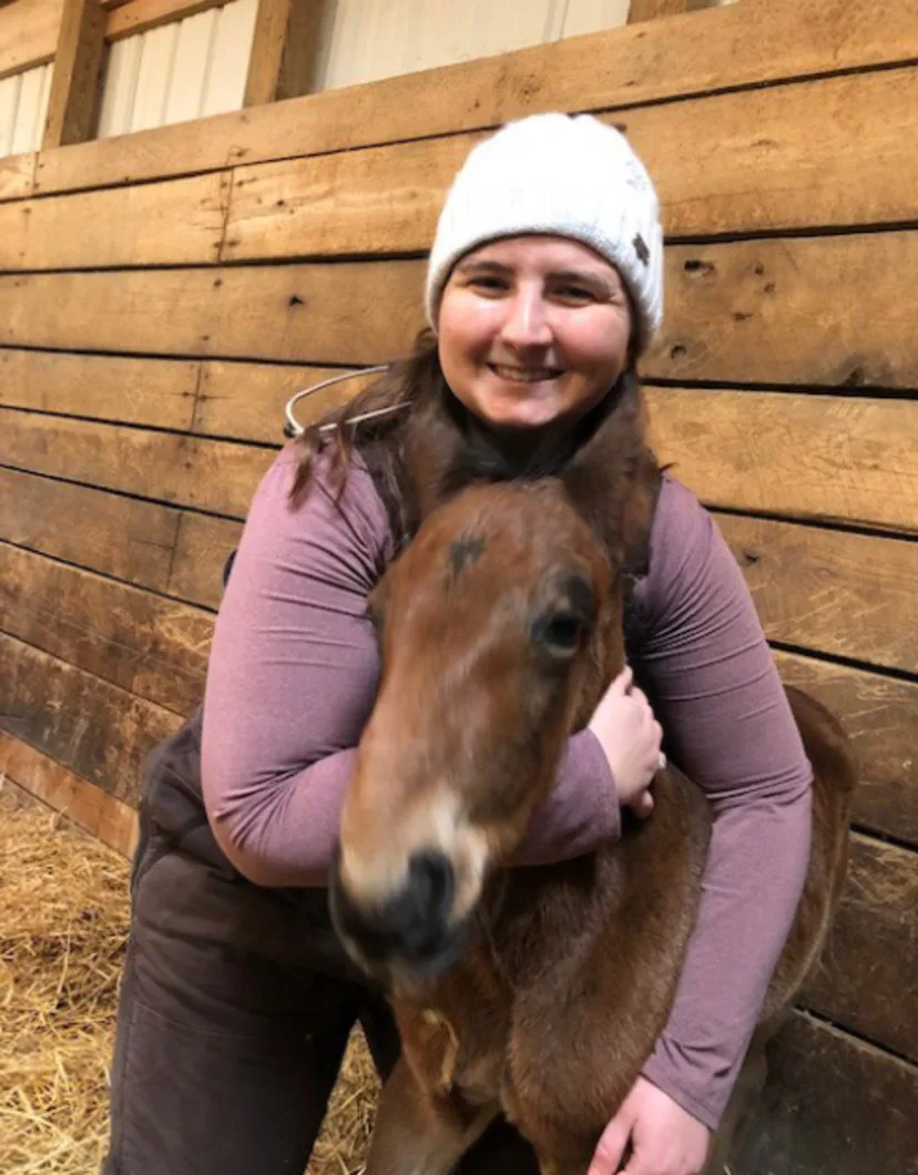 Sara Brunsden with a brown foal