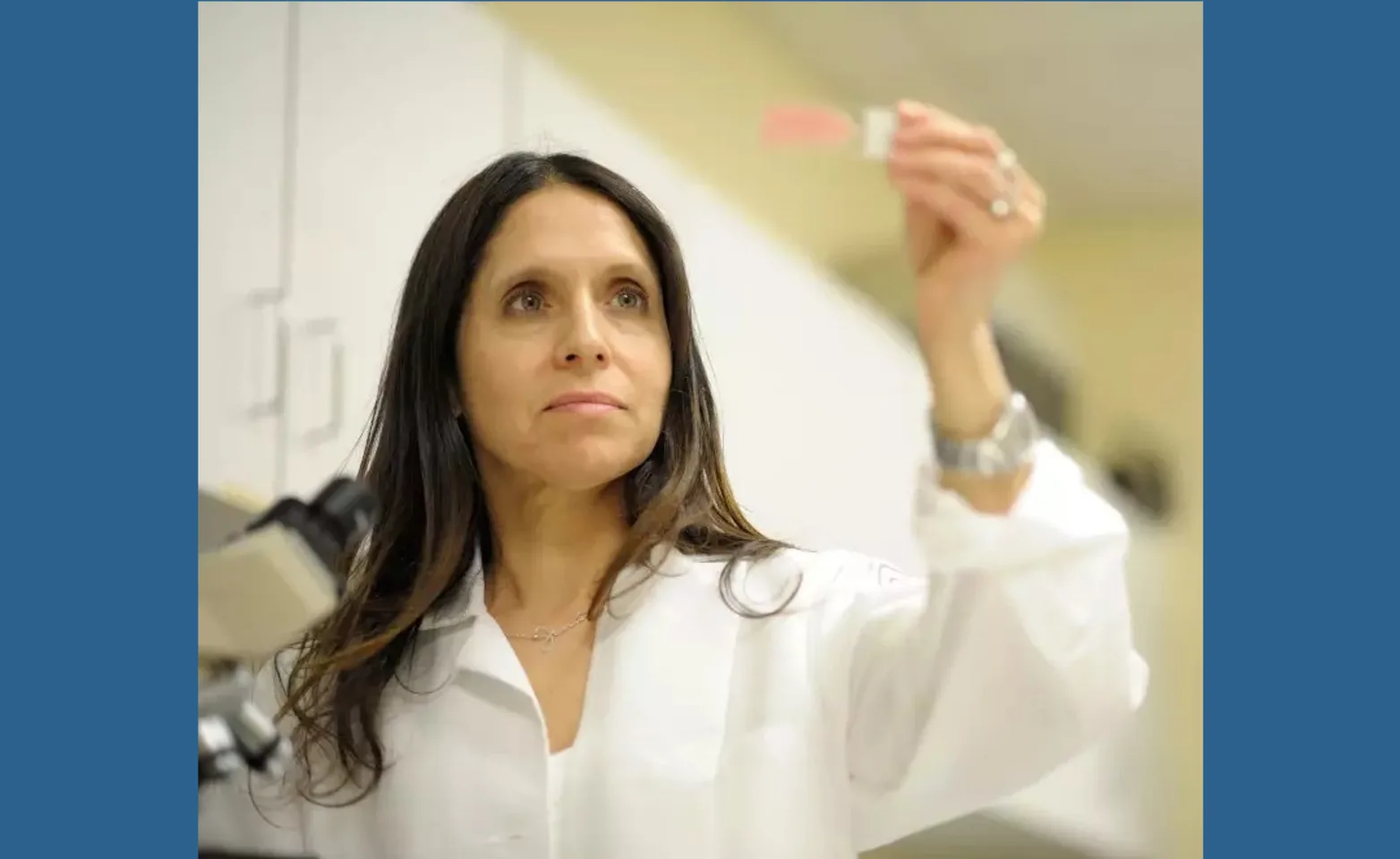 Woman checking a slip of paper that may indicate medical test results Woman checking a slip of paper that may indicate medical test results