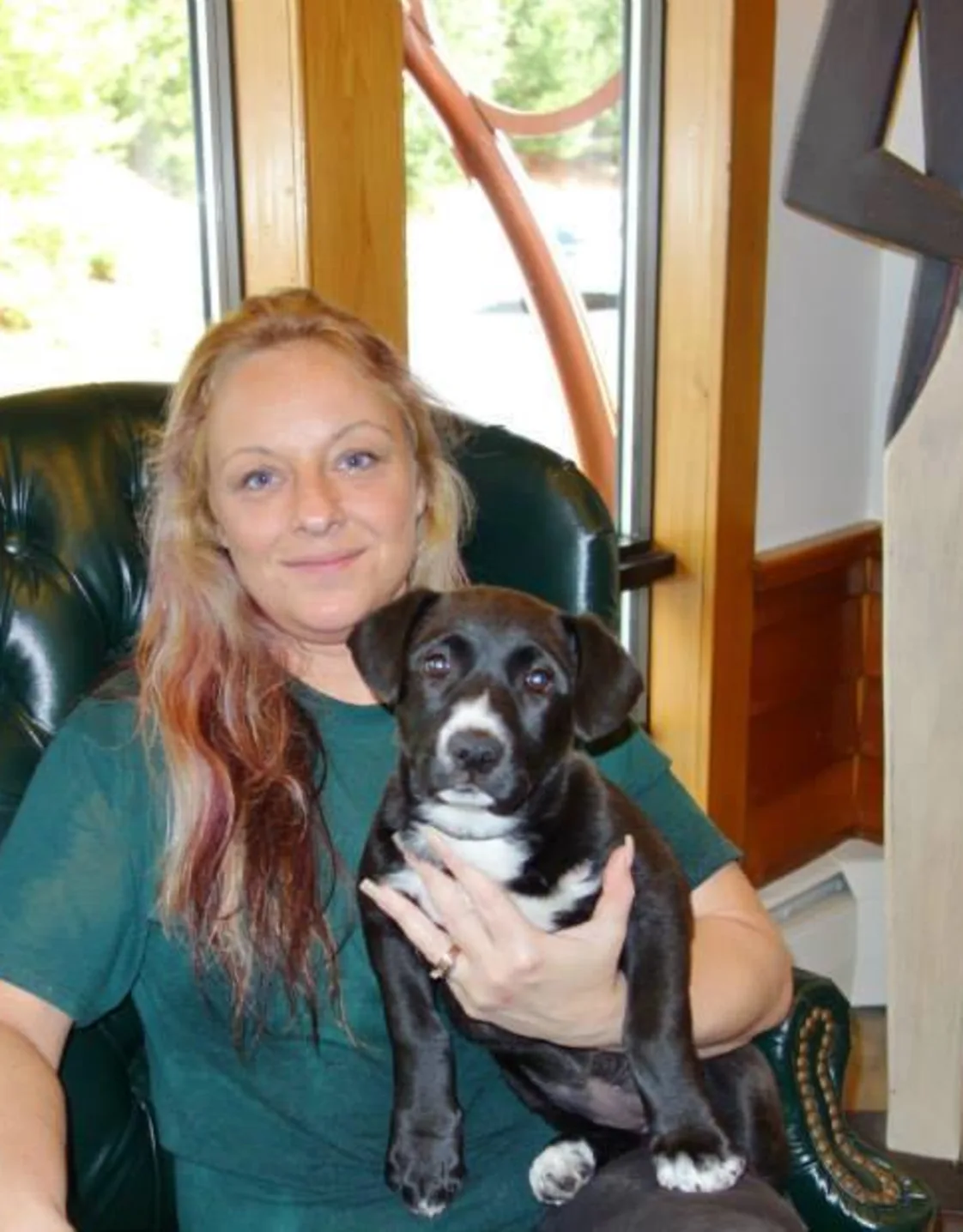 Diane holding a puppy. Diane holding a puppy.