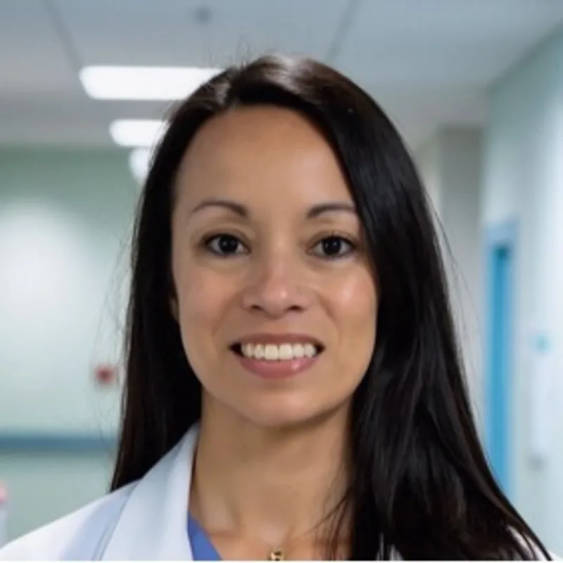 Dr. Eryn Leffers smiling in front of a grey backdrop Dr. Eryn Leffers smiling in front of a grey backdrop