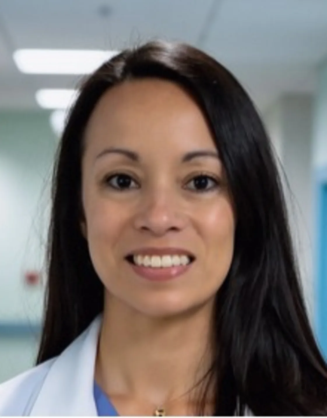Dr. Eryn Leffers smiling in front of a grey backdrop Dr. Eryn Leffers smiling in front of a grey backdrop