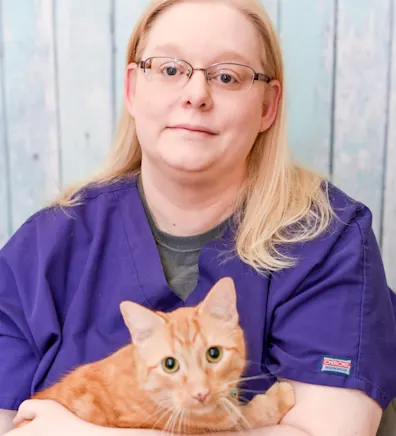 Clar holding tabby cat Clar holding tabby cat