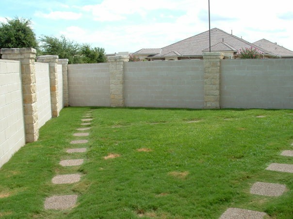 Grassy backyard play area at Windhaven Veterinary Hospital