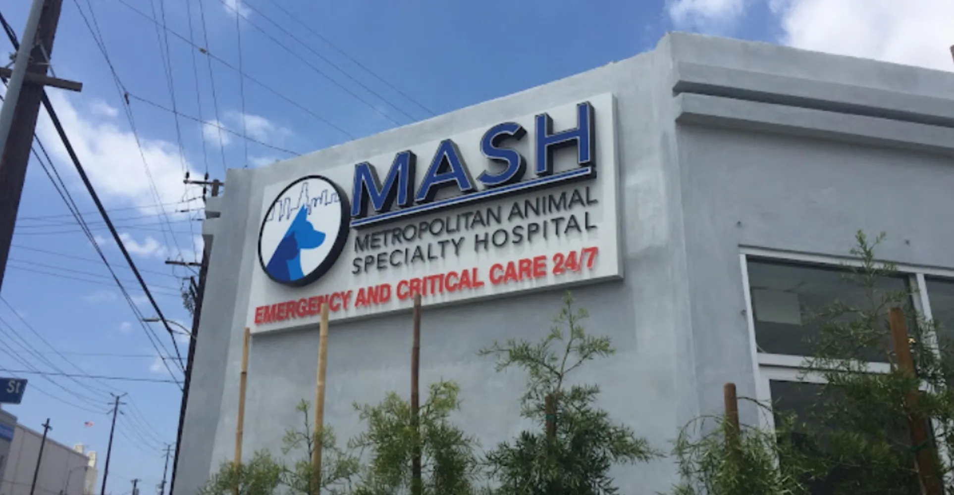 MASH building with a rainbow in the sky