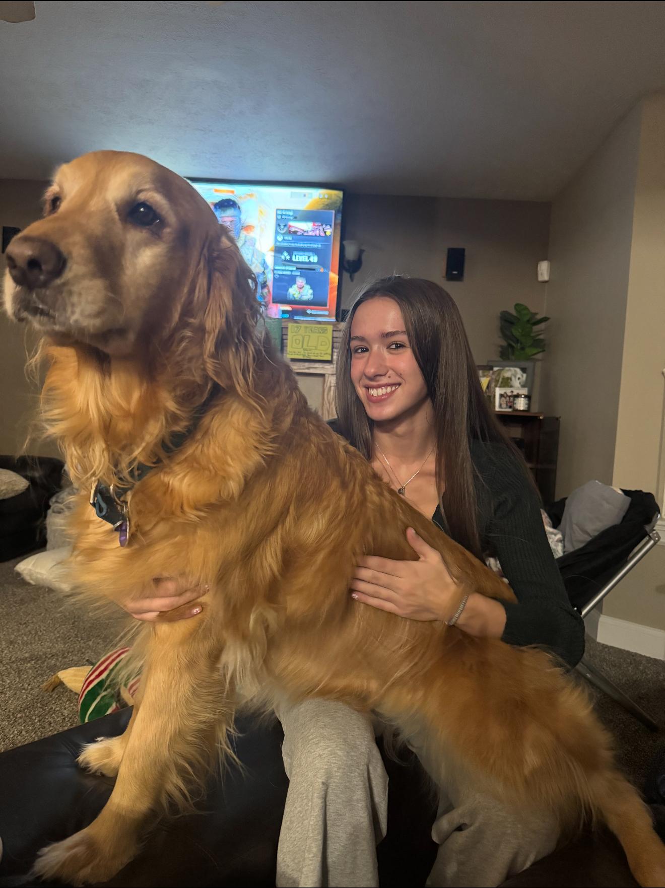 Isabella with a golden retreiver