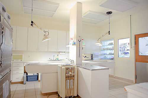 SURGERY TABLES IN A LIT ROOM