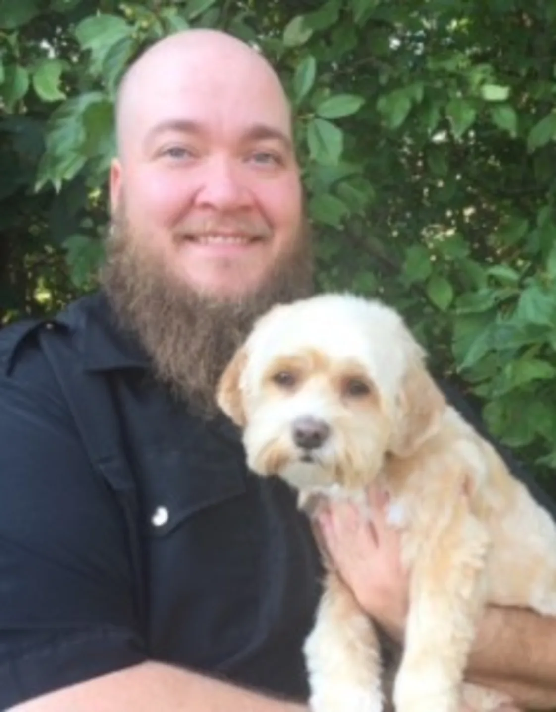 Chris holding a dog Chris holding a dog