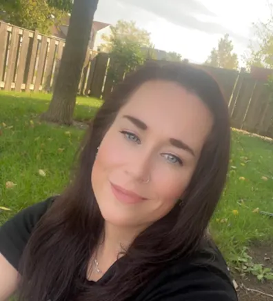 Mary in a backyard. Mary in a backyard.